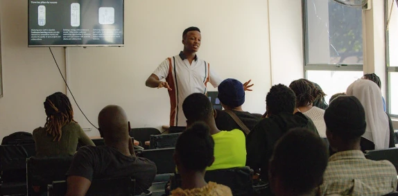 Joseph Raina teaching students in a classroom